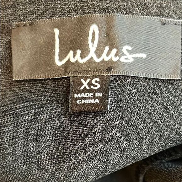 Lulu's Black Jumpsuit with Cold Shoulder and Wide-Leg Design - Picture 8 of 9